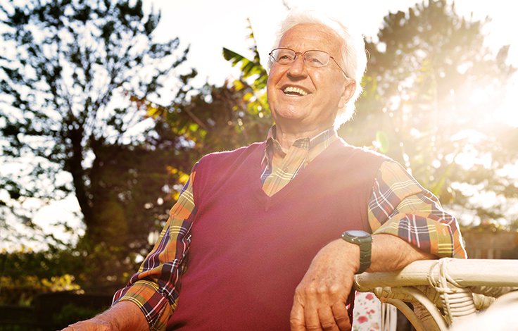 smiling senior man in a park